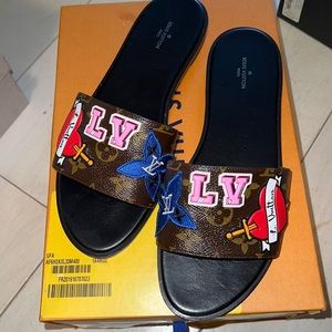 Authentic gently used black heart Louis Vuitton sandals size 40